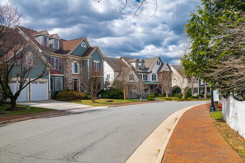 neighborhood of single-family homes with garages and driveways in a Washington, D.C. suburb.