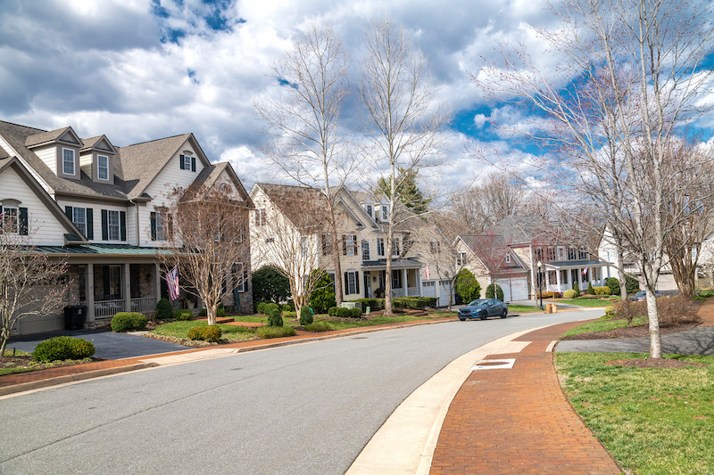 neighborhood of single-family homes with garages and driveways in a Washington, D.C. suburb.